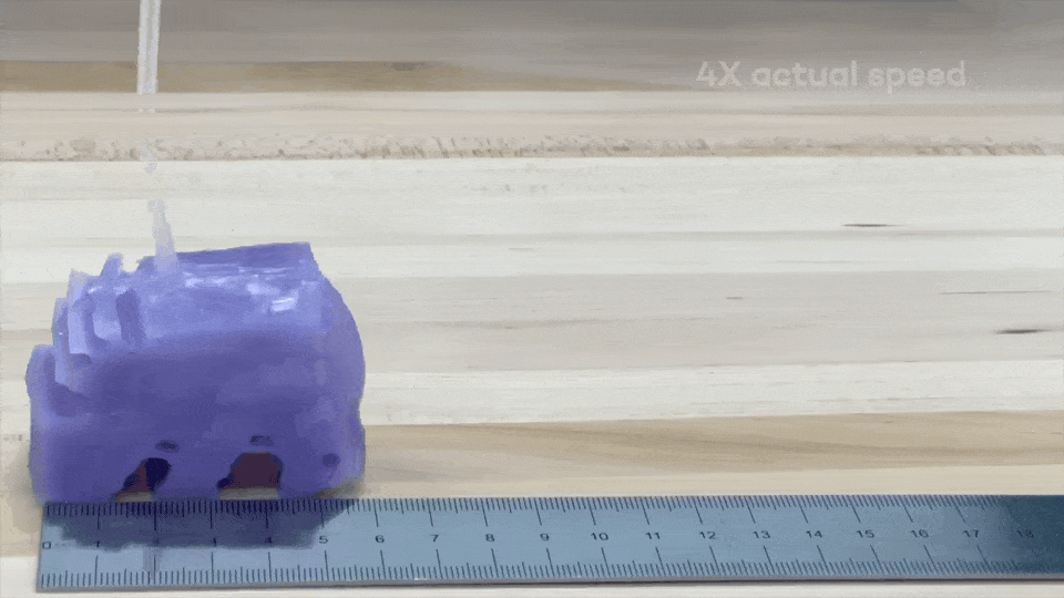 AI-designed soft robot walking under cyclic inflation