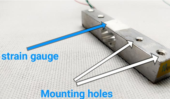 The primary components are the load cell and the HX711 amplifier module.
