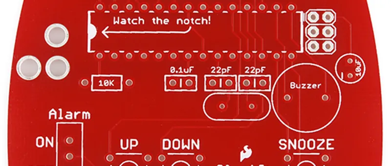 Clock circuit bare-board detail; button and buzzer positions affect nearby component arrangement.