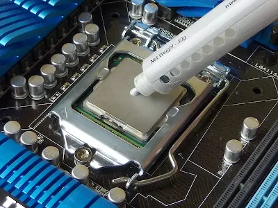Close-up of thermal paste spreading on metal core surface
