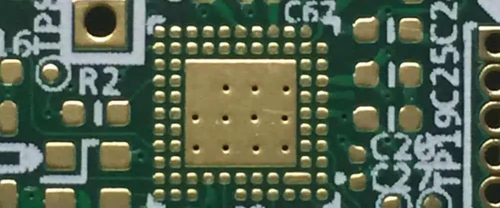 Cross-section of a thick copper PCB showing thermal vias for heat dissipation