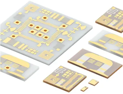 Close-up of a ceramic PCB showing a precisely etched microstrip line on an alumina substrate