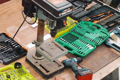 Organized workspace with PCB drill bits and essential tools