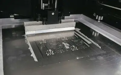 SMT stencil printer applying lead-free paste to PCB
