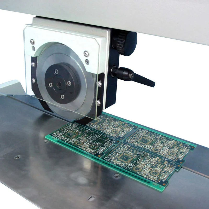 High-speed router bit cutting through a PCB connection tab during depaneling