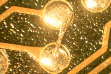 Close-up of solder balls on PCB after reflow