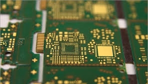 Close-up of fine-pitch components on a PCB after solder paste application