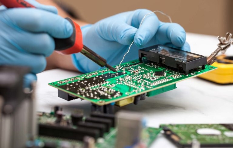 Manual soldering of through-hole components on a PCB