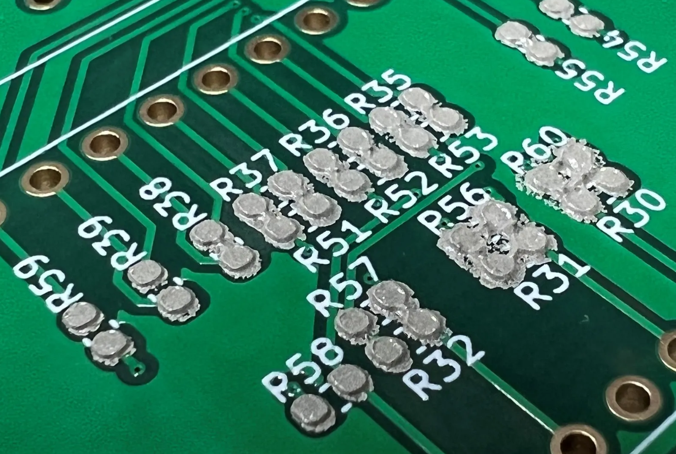Close-up of solder paste deposits on PCB pads after step-up stencil printing