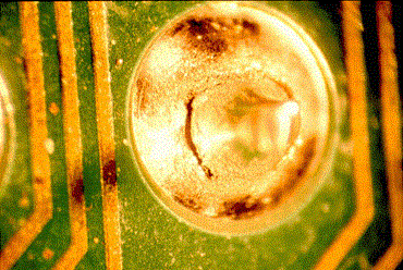 Microscope view of a cracked solder joint due to thermal stress