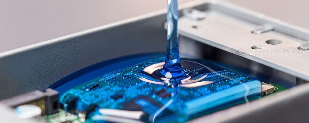 Applying potting resin to an electronic assembly