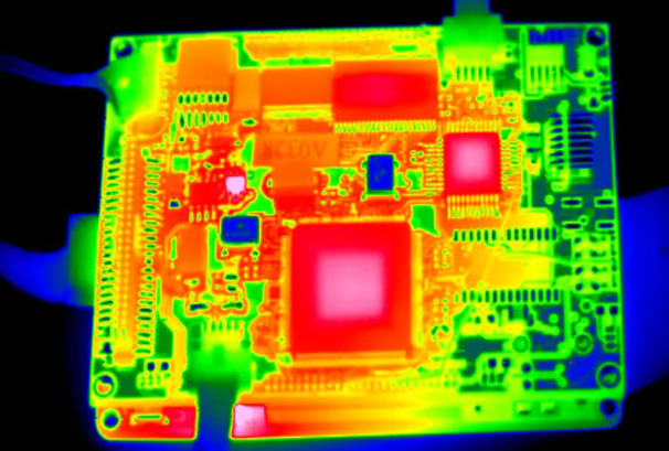 Infrared image showing heat dissipation through plated through-holes on a circuit board