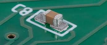 view of a surface mount component with perfectly formed solder fillets