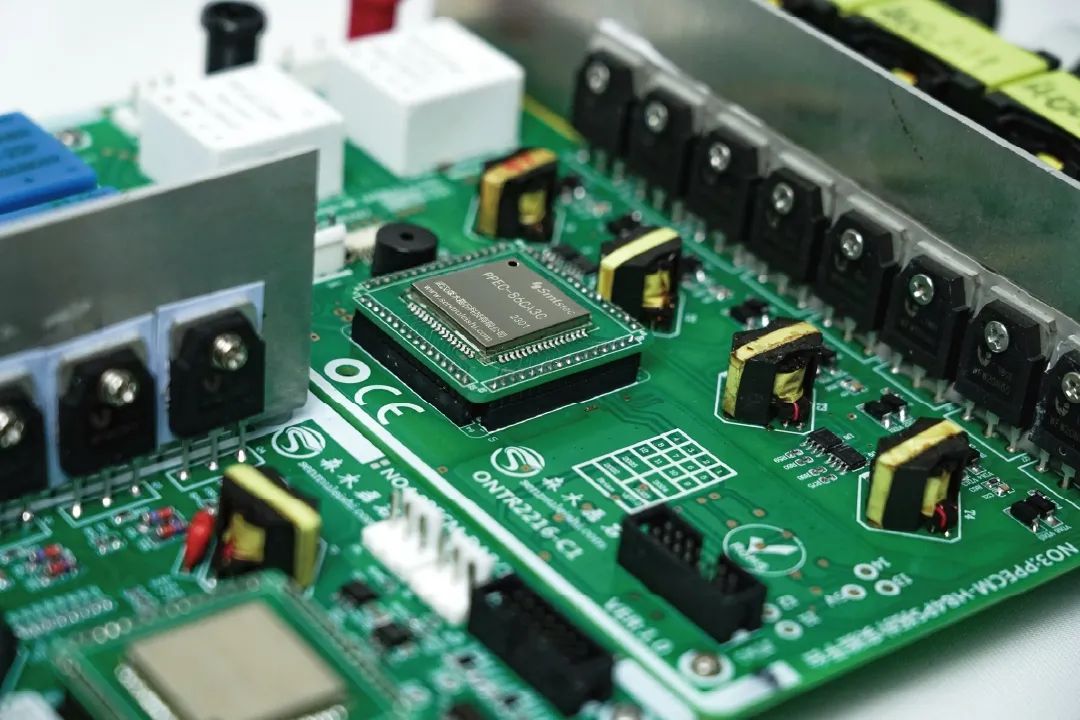 Close-up of a multilayer PCBA with power MOSFETs, thermal vias, and thick copper traces