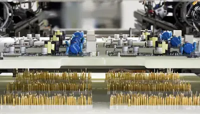 Bed-of-nails ICT fixture probing a PCB assembly