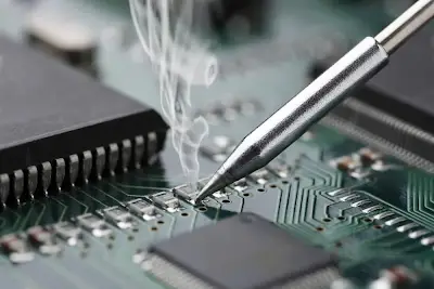 Close-up of tin-silver-copper solder joint on PCB surface