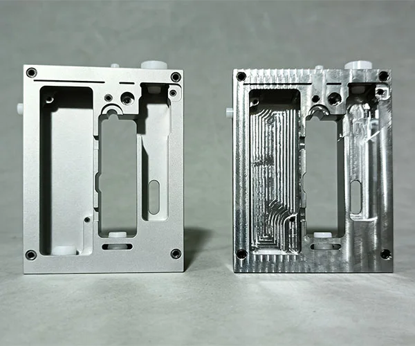 Close-up comparison of bead blasted matte surface versus linear brushed finish on CNC aluminum parts.