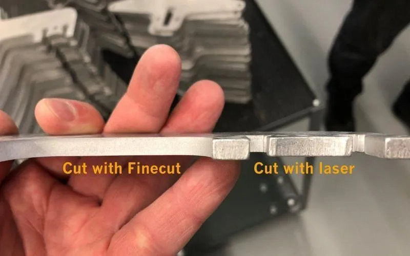 edge photographs comparing laser-cut stainless versus waterjet-cut stainless