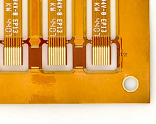 Close-up photo of a finished FPC panel showing multiple connection tabs with clear perforation lines