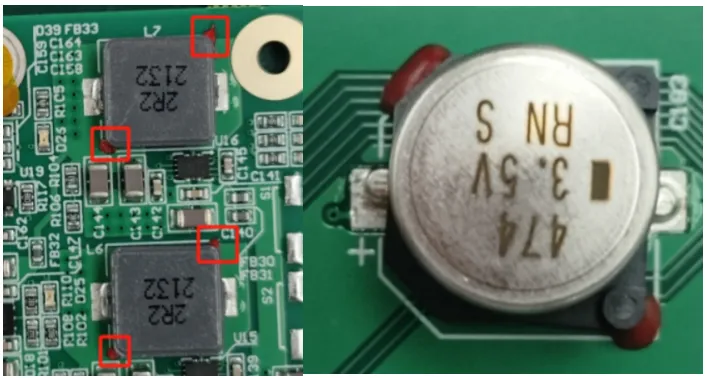 Red glue dots placed at the sides of a large SMD for double-sided reflow