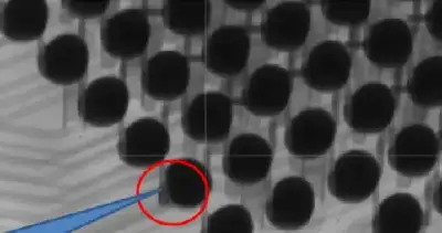 Oblique X-ray at 53 degrees shows solder ball separated from internal contact pin