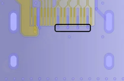 GND via next to a high-speed connector ground pad