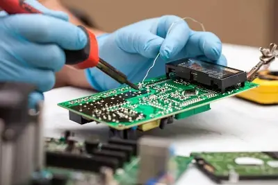 Technician Soldering Prototype PCB
