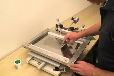 Stencil printer applying solder paste to fine-pitch BGA land pads on PCB