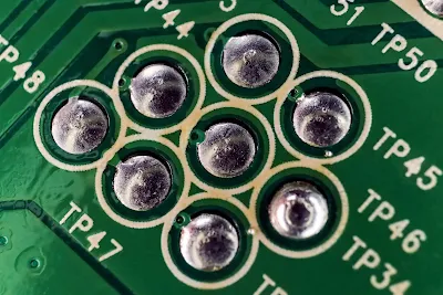 Close-up of solder joint formation on FR-4 PCB