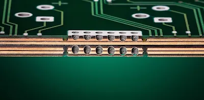 Cross-sectional diagram of heavy copper PCB showing 4 oz power layers and thermal vias in an aircraft cockpit display module