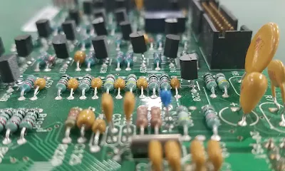 Close-up of through-hole components soldered on a PCB