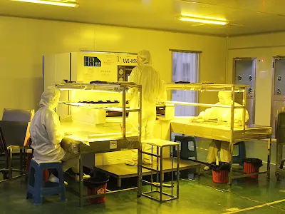 Laminating dry film solder mask onto a PCB in a cleanroom environment