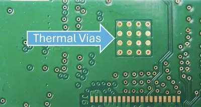 Close up of thermal vias on a PCB for heat dissipation