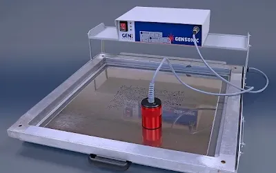 Ultrasonic cleaning setup for a step-up stencil to remove solder paste residues