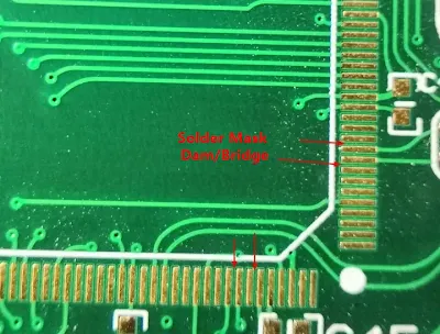 solder mask dam between fine-pitch pads