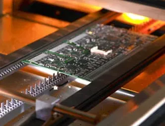 PCB inside a reflow oven during soldering process