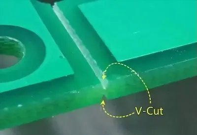 A PCB panel showing V-shaped grooves for depaneling