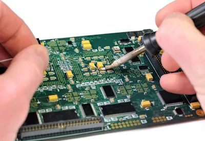 Close-up of a compact IoT PCB with densely packed SMT components