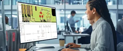 Engineer reviewing a PCB schematic on a computer screen