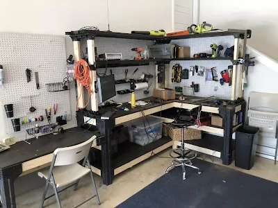 A tidy home lab setup with labeled component bins and tools
