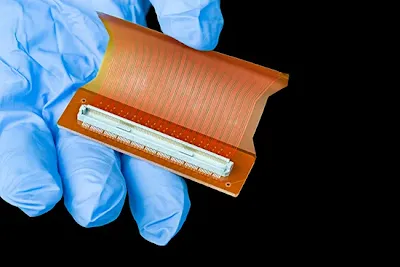 FPC tape adhesive overflow beyond the flex PCB edge