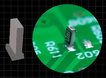 SMT chip capacitor tombstoned upright on one PCB pad after reflow soldering